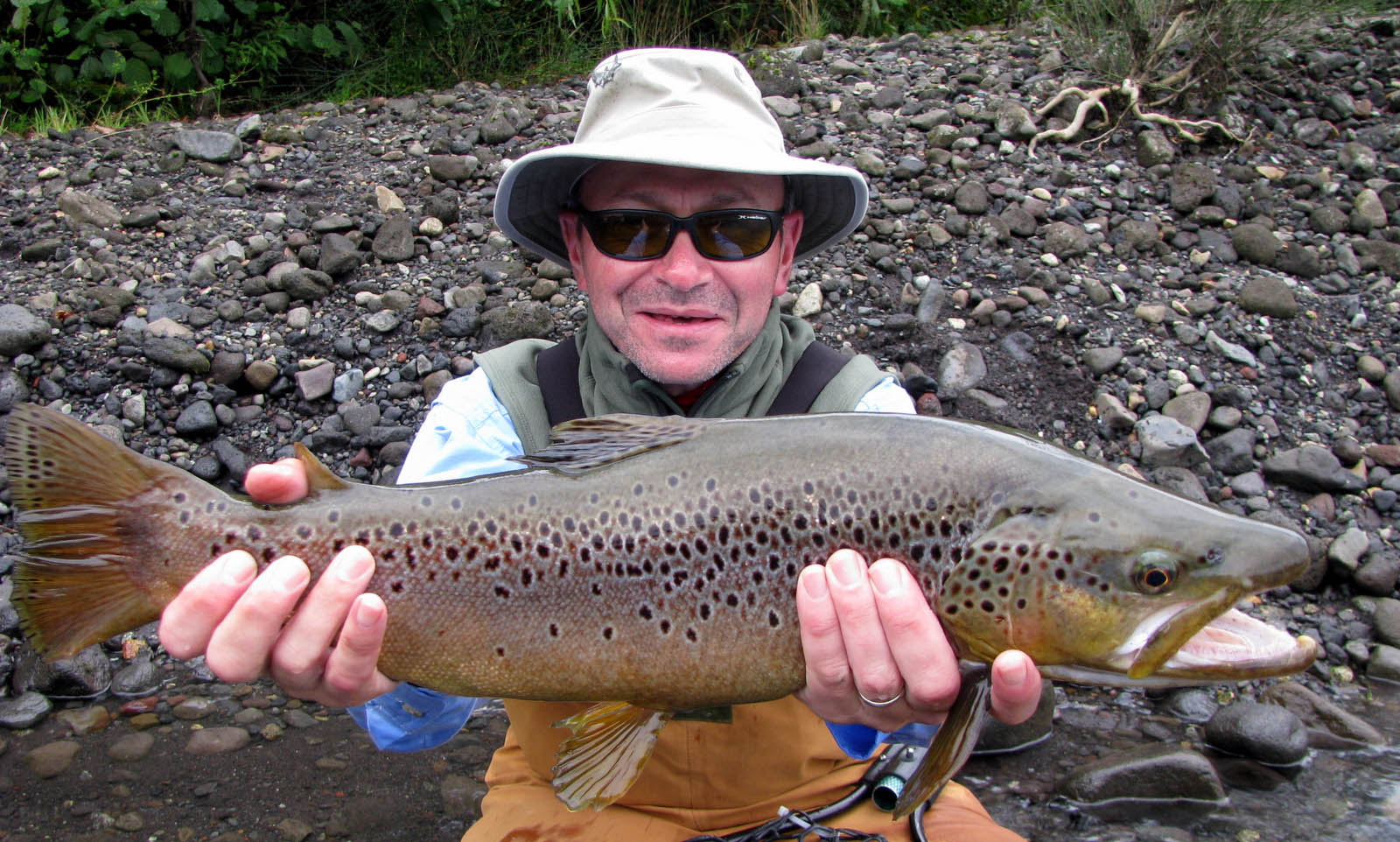 Gerry shows us one of his big brown trout on a float trip down the Rio Petrohue.  Gerry is another of the few anglers that have caught 5 or more trout over 20 inches in one day while fishing with guide John Joy of Puerto Varas, Chile.